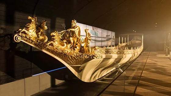 Naval history exhibit at the Scheepvaartmuseum Amsterdam showcasing ship models, maritime maps, and Dutch naval heritage artifacts


