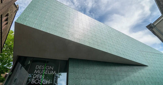 Design Museum Den Bosch external view of a cubic building with blue sky