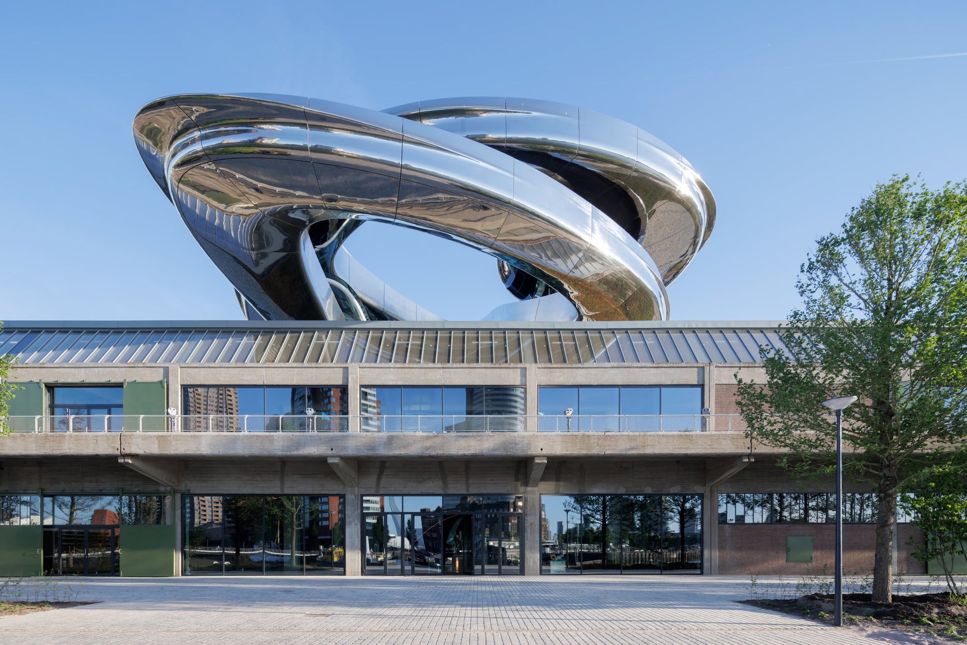 Fenix Rotterdam Migration Museum outside view with the artwork of a metal slide on top.