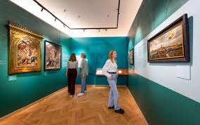 Gorcums Museum Gorinchem inside view of a art work hall with paintings on a green wall