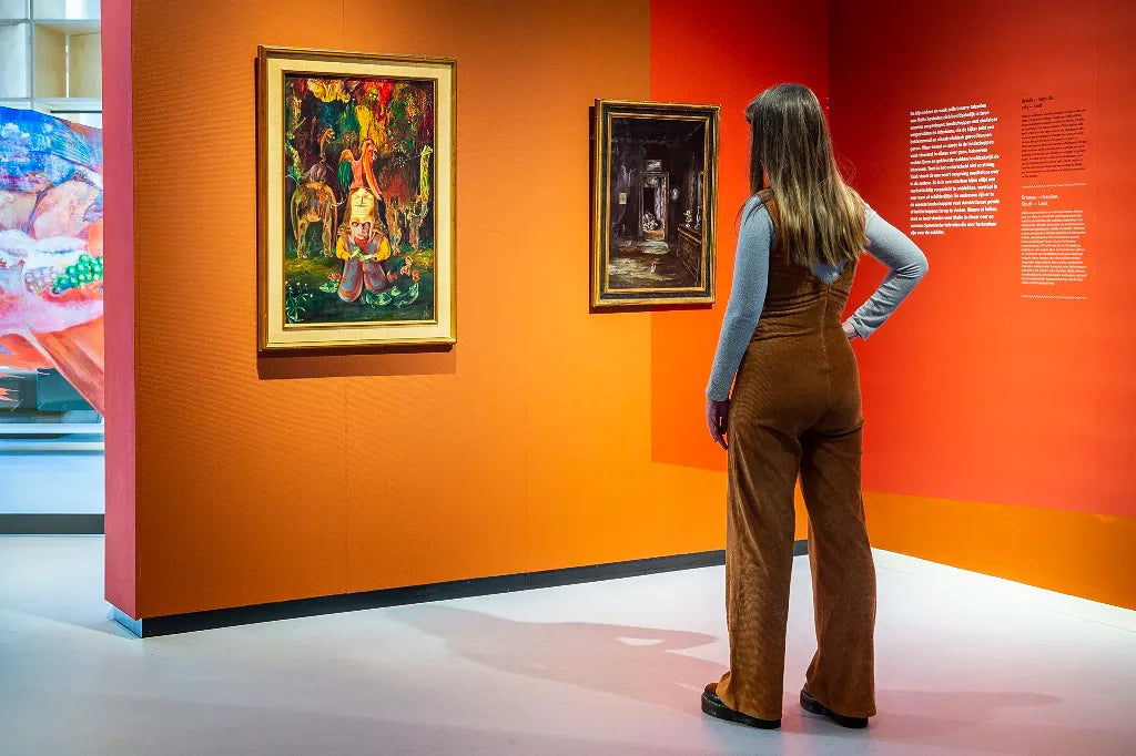 Exhibition view of “Melle: Painter of a Different Reality” at Museum van Bommel van Dam, showcasing surreal and imaginative artworks in a gallery setting.