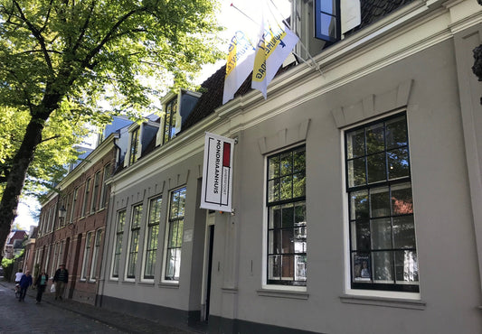 Mondriaanhuis Museum outside view with trees overhanging the building